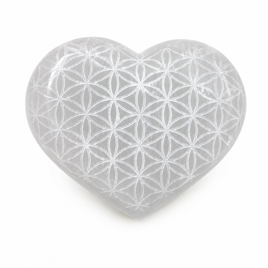 Heart-shaped crystal with Flower of Life pattern on a white background